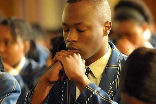 Praying school children