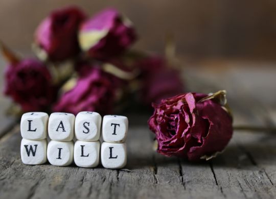 small wooden blocks with letters on them are laid in the floor on the old wooden table