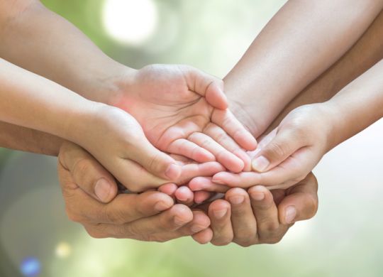 Family hands praying together (clipping path) for donation charity concept